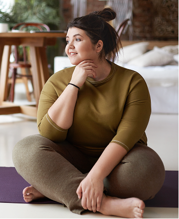 A woman sitting with her hand to her chin